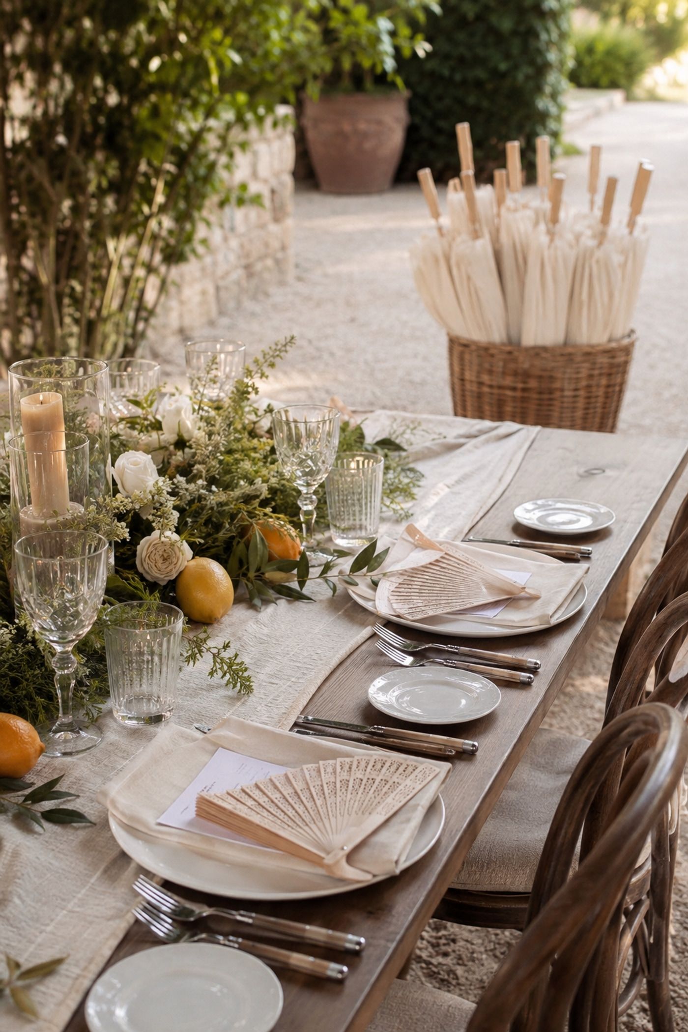 Paper fans and parasols styled into a summer table