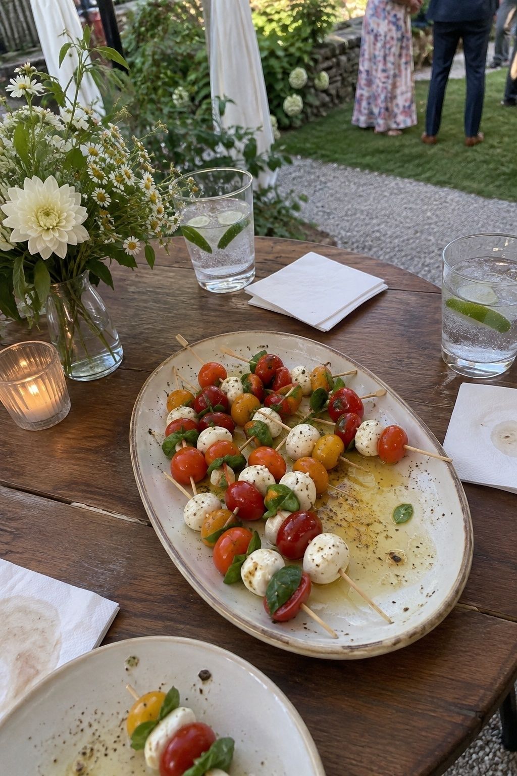 Tomato mozzarella and basil skewers served at an intimate summer wedding