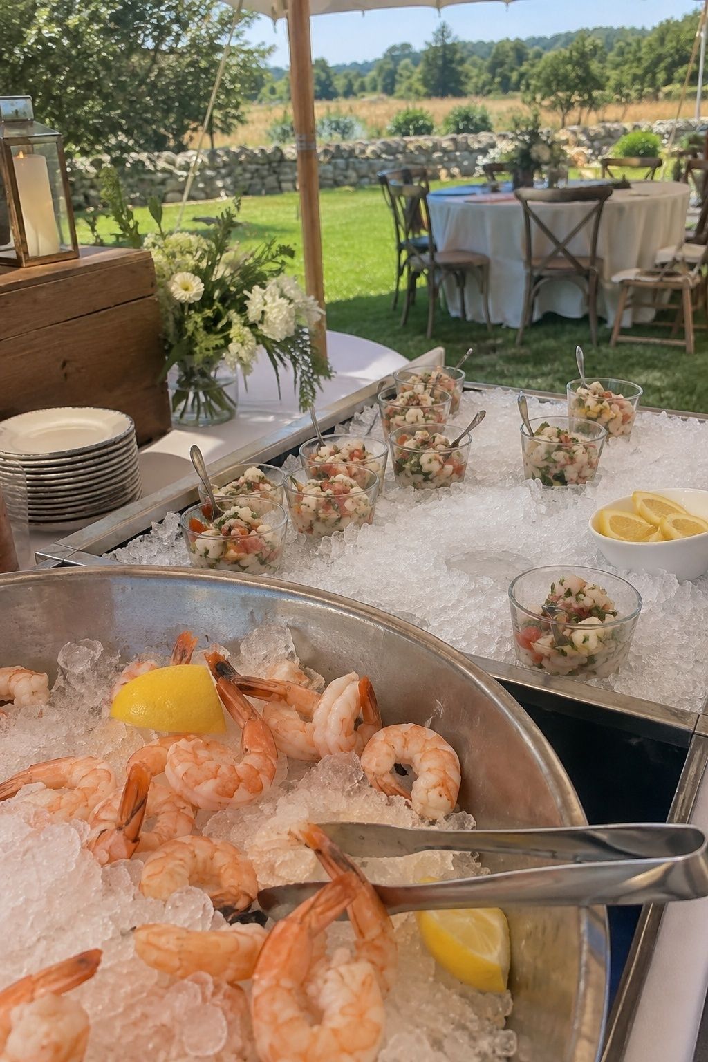 Shrimp and ceviche kept on deep ice at a shaded summer wedding station
