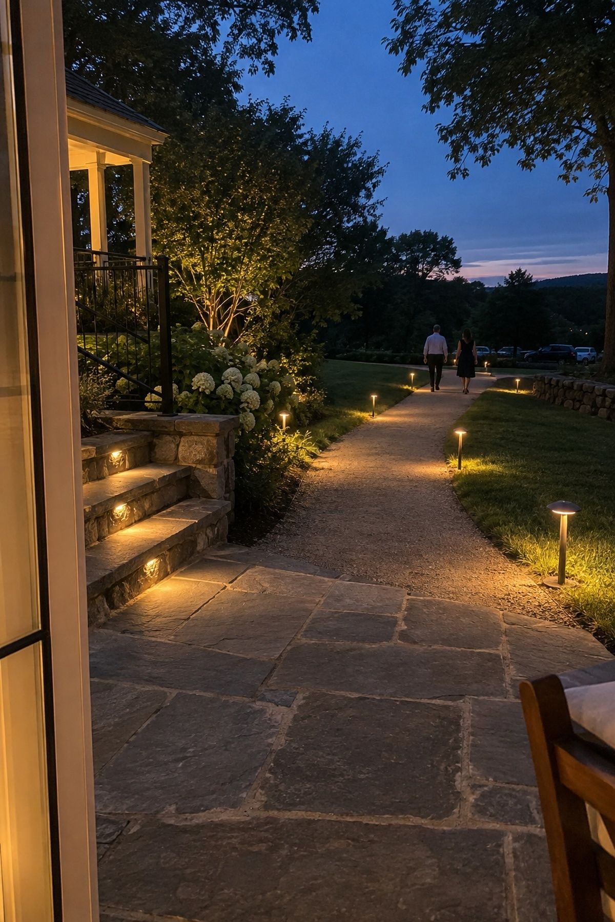Low path and step lights switched on before a summer wedding gets dark