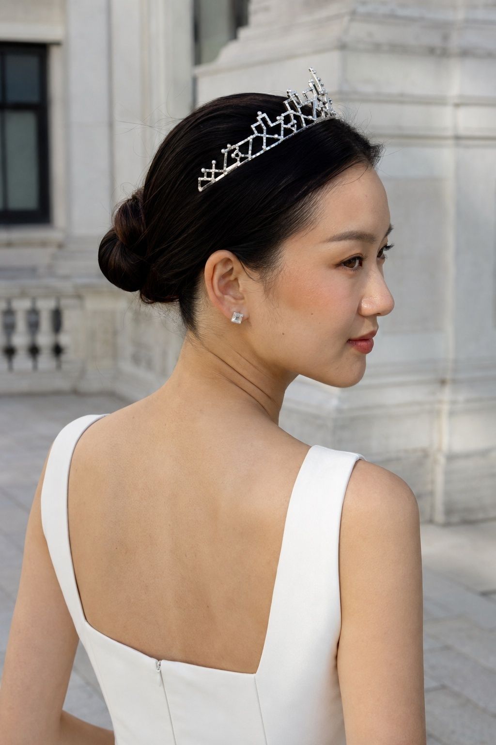 Sleek bun with a modern tiara