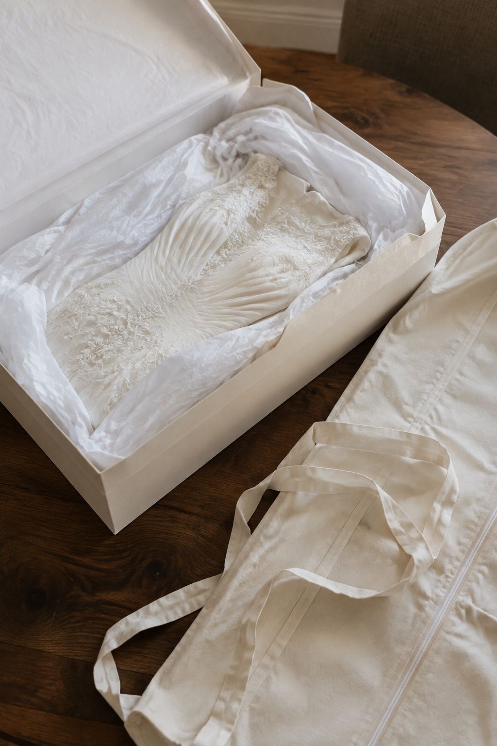 Bridal gown nestled in tissue inside an open preservation box