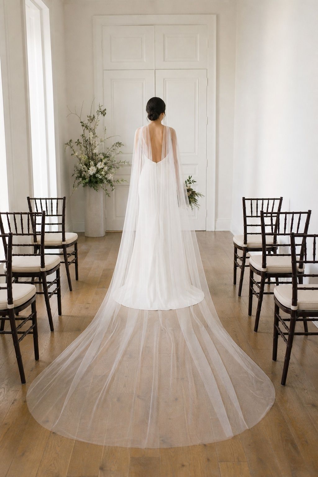 Cathedral-length cape on a narrow indoor aisle