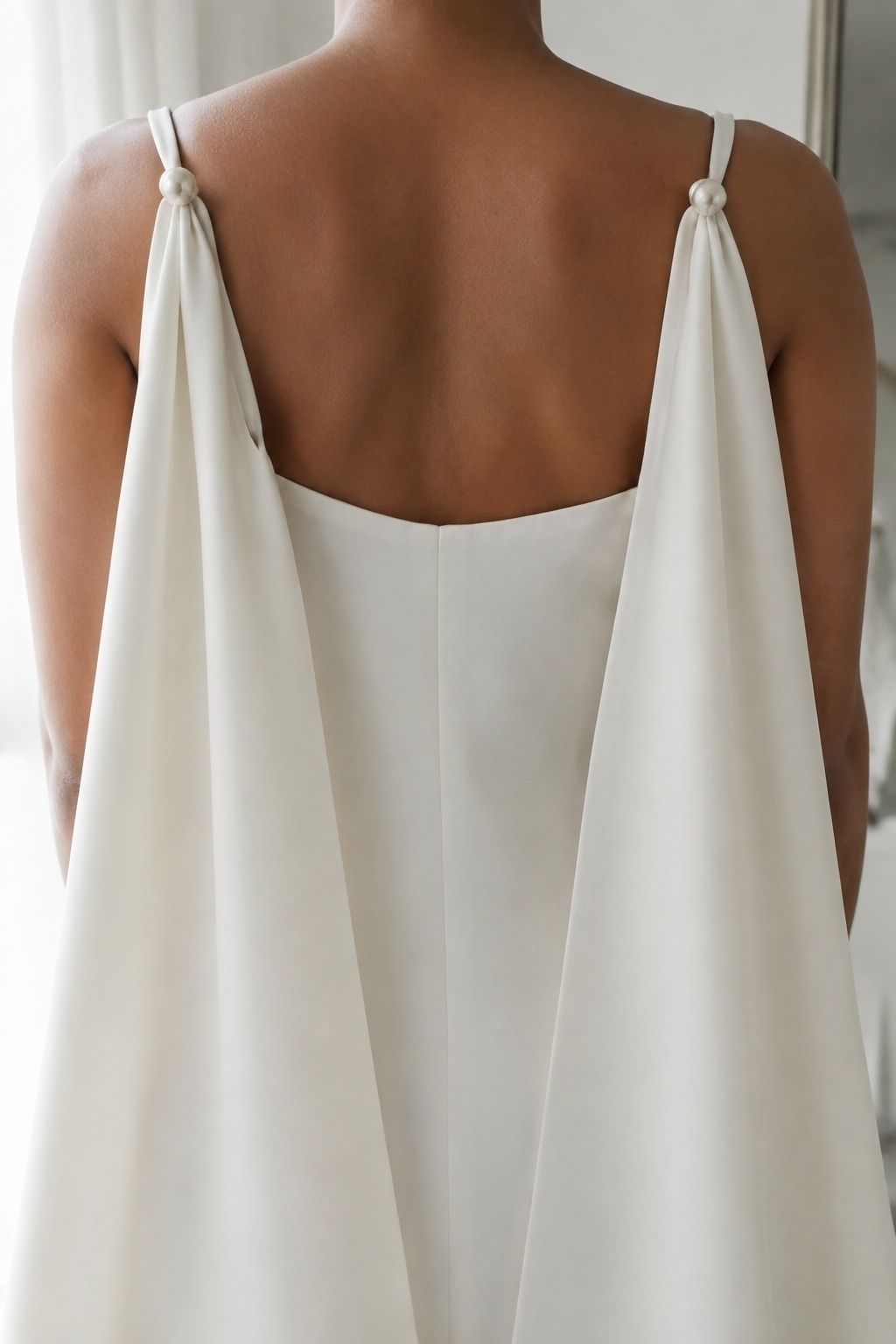 Bridal cape attached at the shoulders