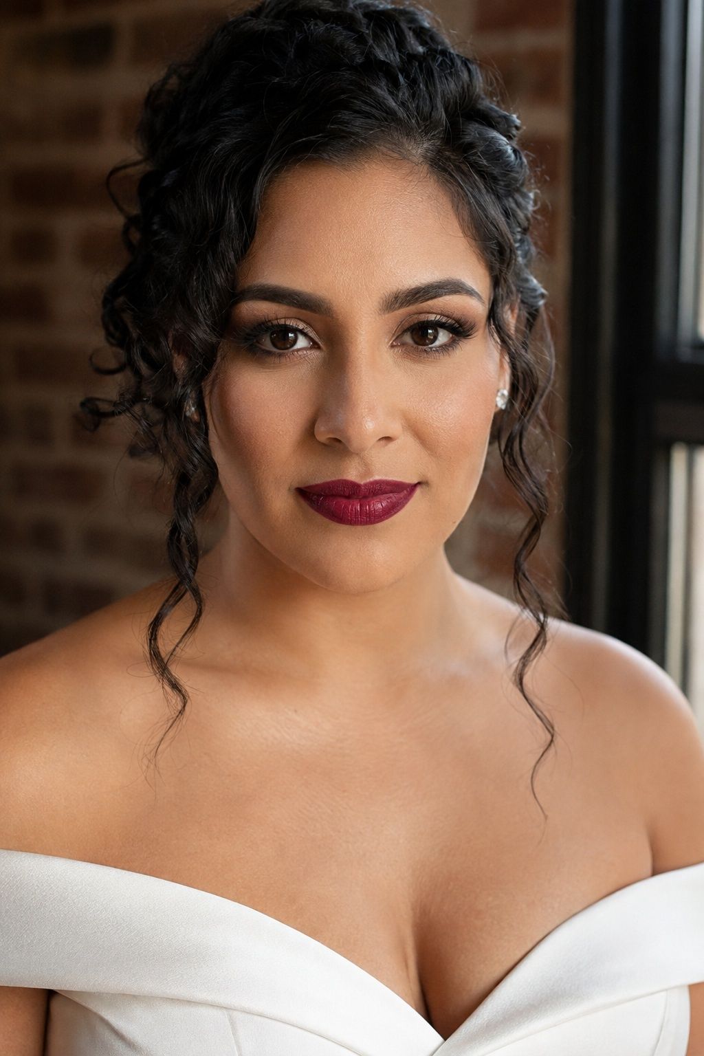 Bride wearing precisely lined berry lipstick and soft taupe eye makeup.
