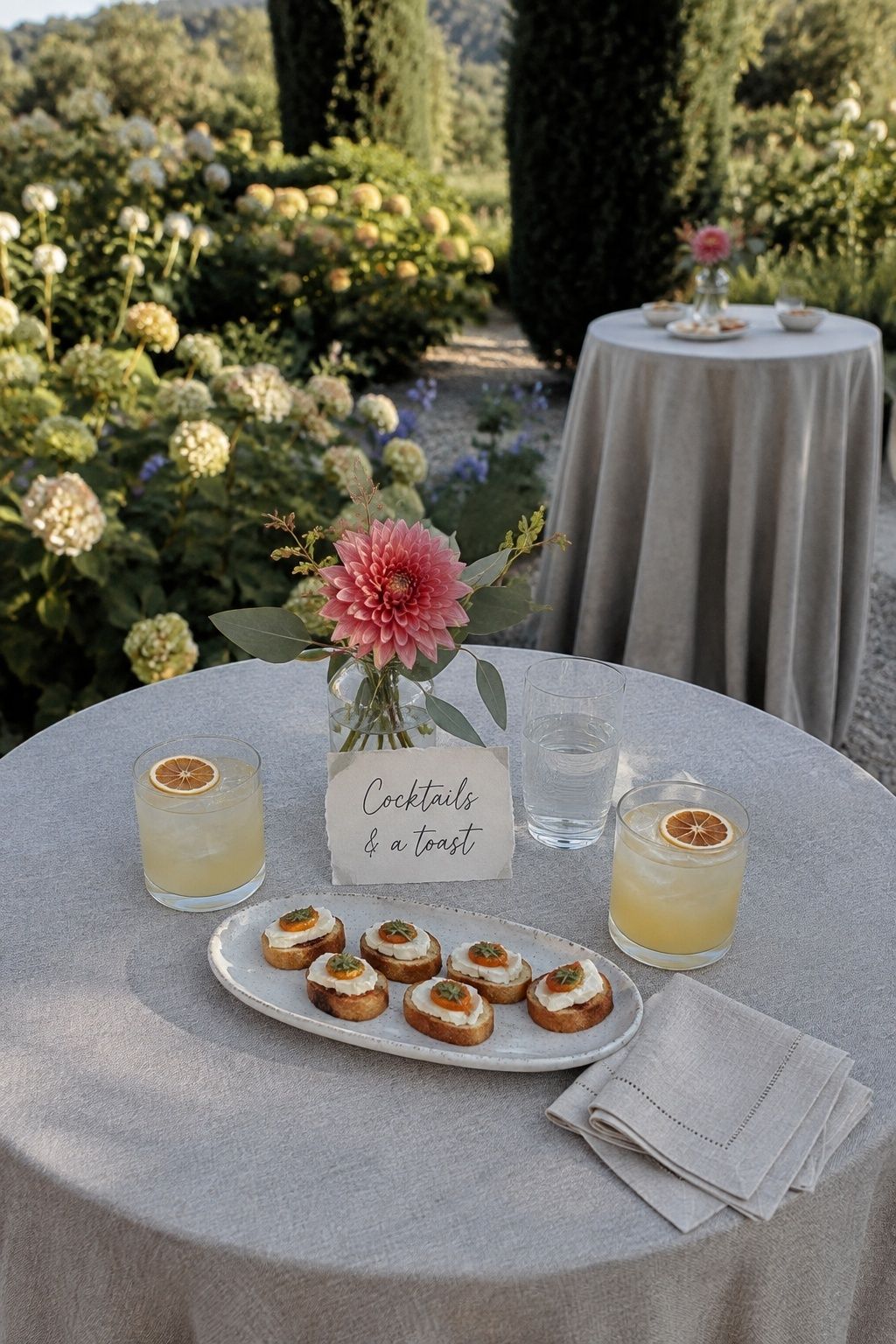 Cocktails and crostini on a patio table for a celebration after eloping.