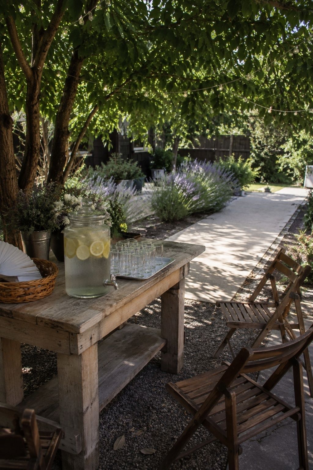 Water, folding fans and shaded seating for wedding guests