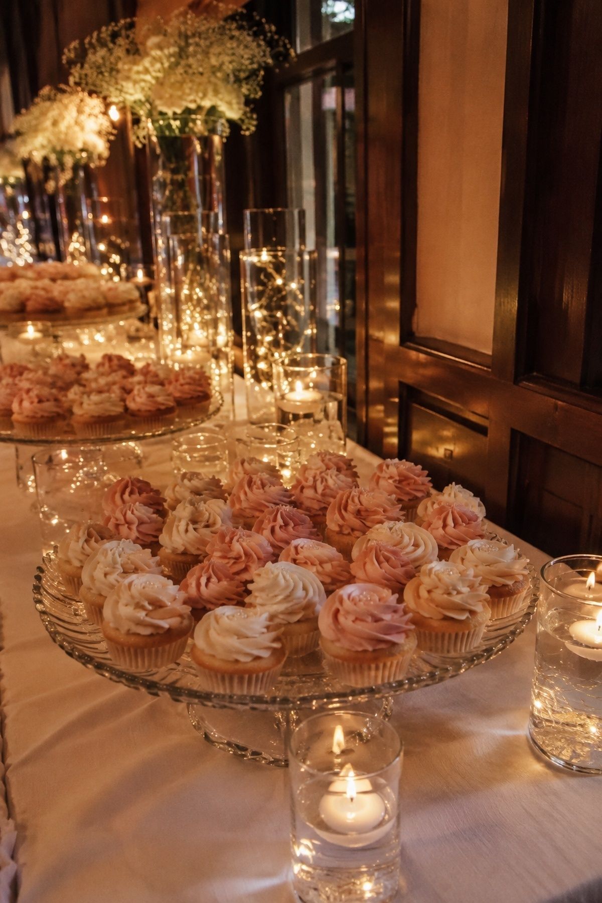 Cupcake display lit with fairy lights