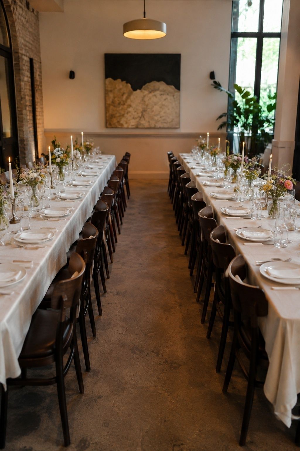 Intimate forty-guest restaurant wedding with two long tables and a wide accessible aisle