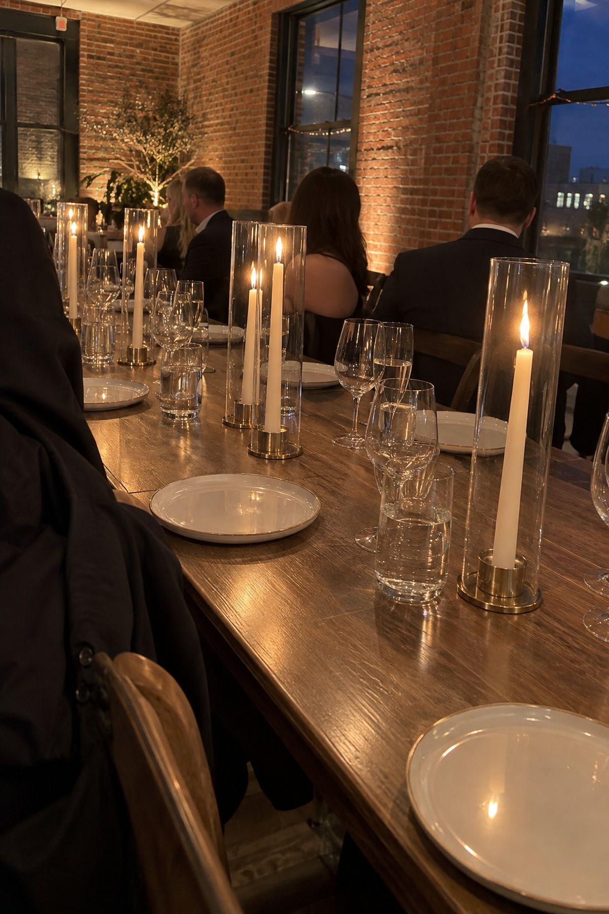 Taper candles protected by hurricane glass