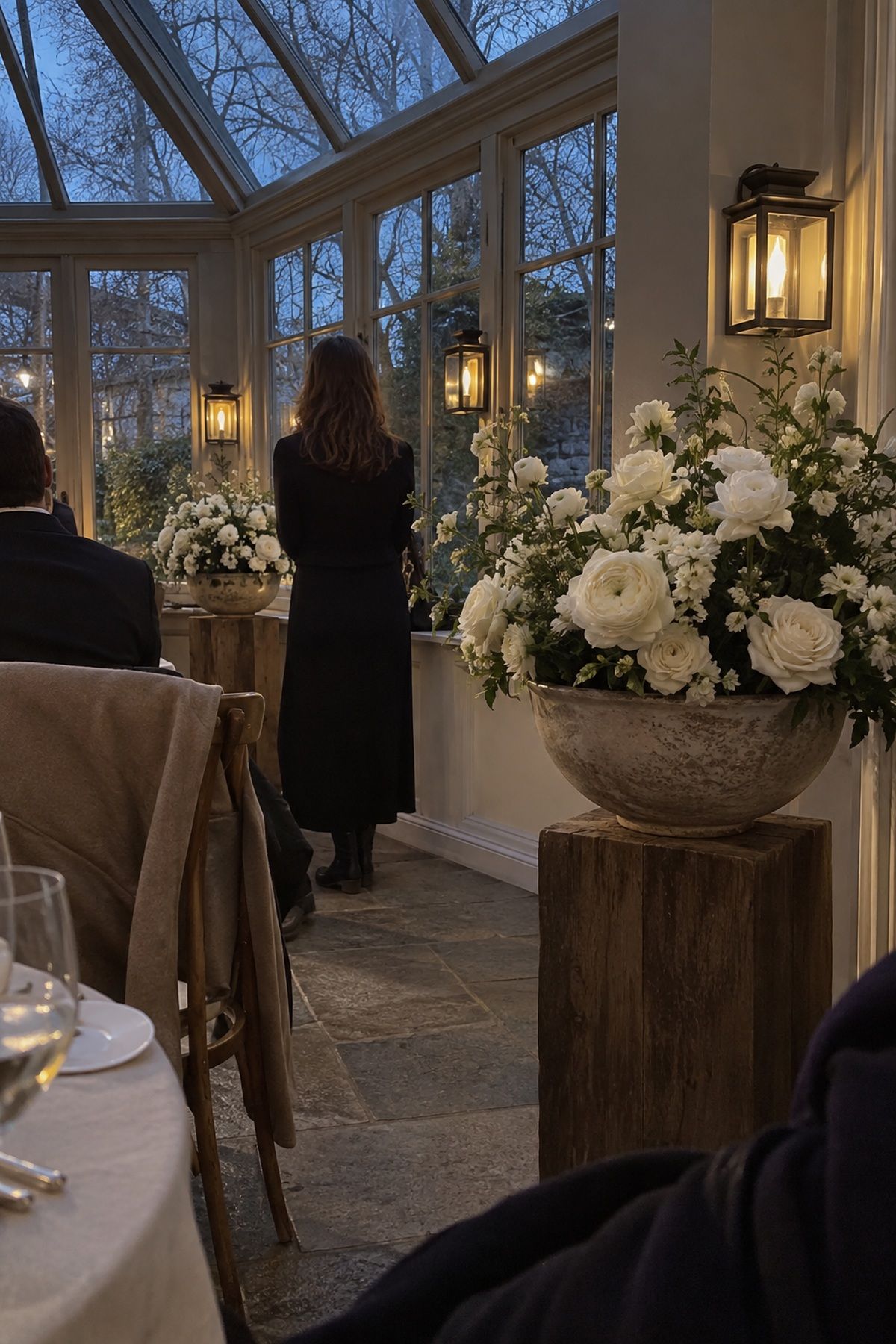 White flowers brightening a candlelit table