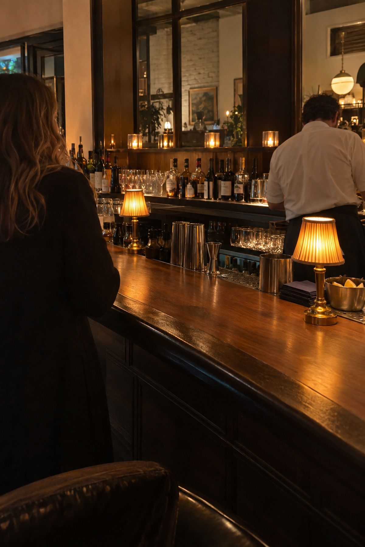 Bar lit with votives and lamps