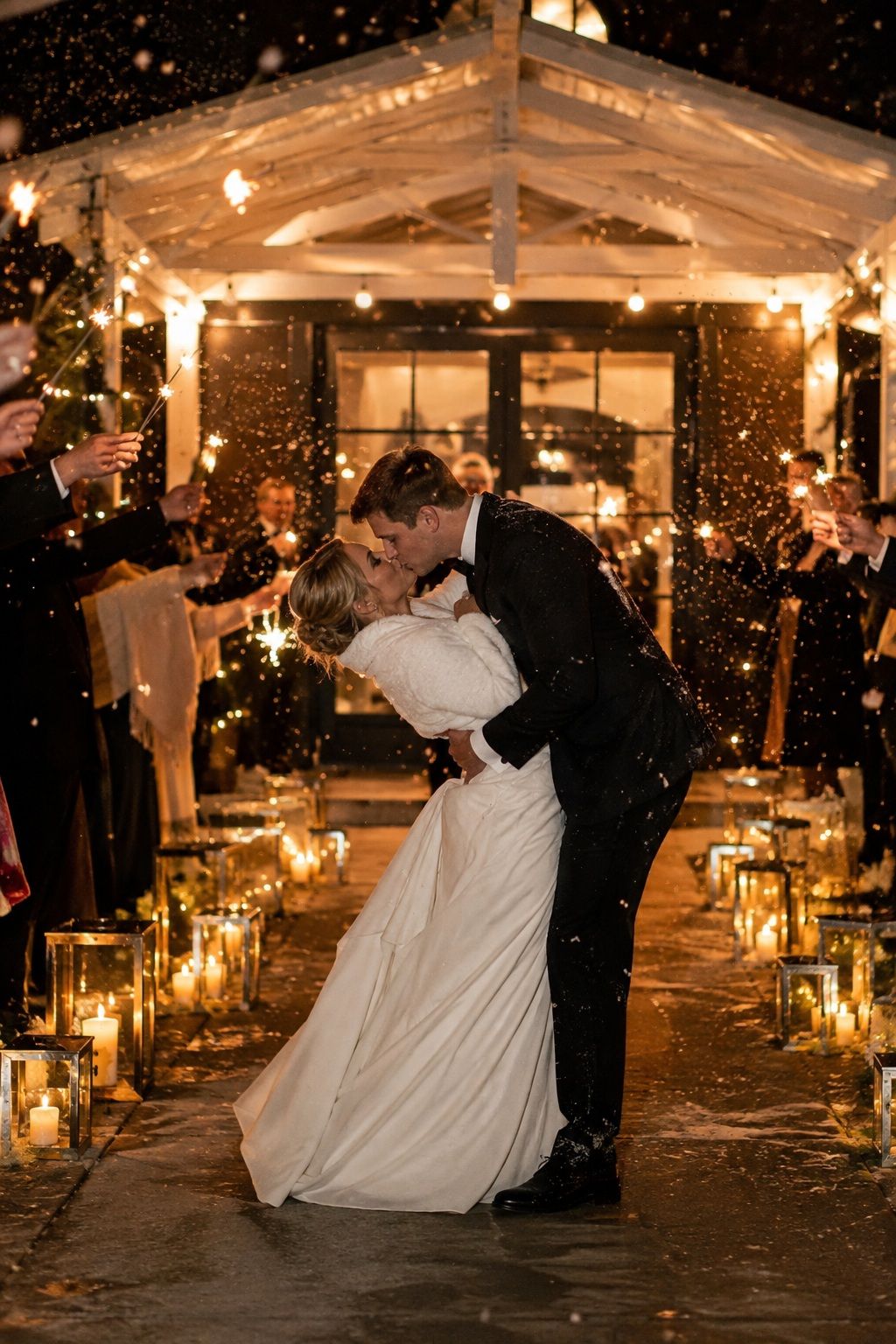 Soft lighting for a snowy wedding exit