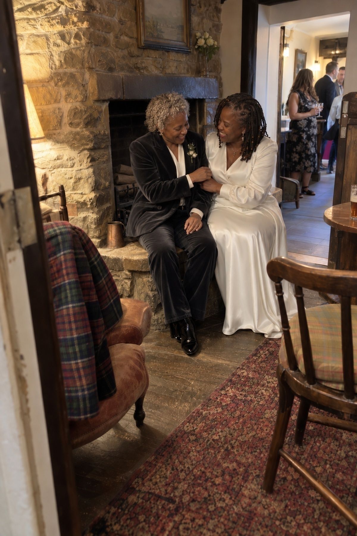 Couple portrait by a fireplace